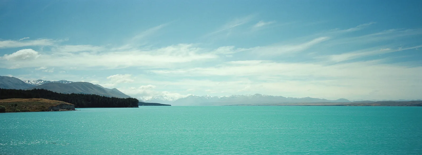 Lake Pukaki glacial turquoise waters with Aoraki Mount Cook — the backdrop for Lake-town and the Lonely Mountain in Peter Jackson's Hobbit films